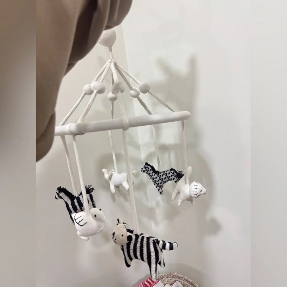 Crate & Barrel Baby Nursery safari animals mobile crib decor newborn neutral